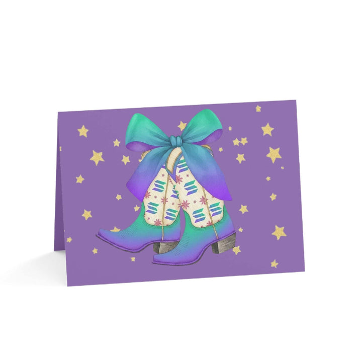 Solana Boots Greeting Card featuring radiant gradient boots with teal-to-purple bow on purple background with stars