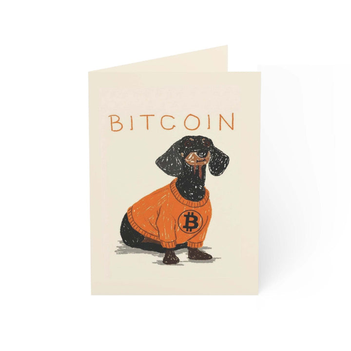 Bitcoin Pup Greeting Card featuring dachshund in orange Bitcoin sweater with Bitcoin text on beige background