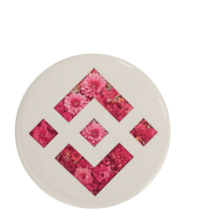 Binance Bloom Pin with floral design on a white round background.