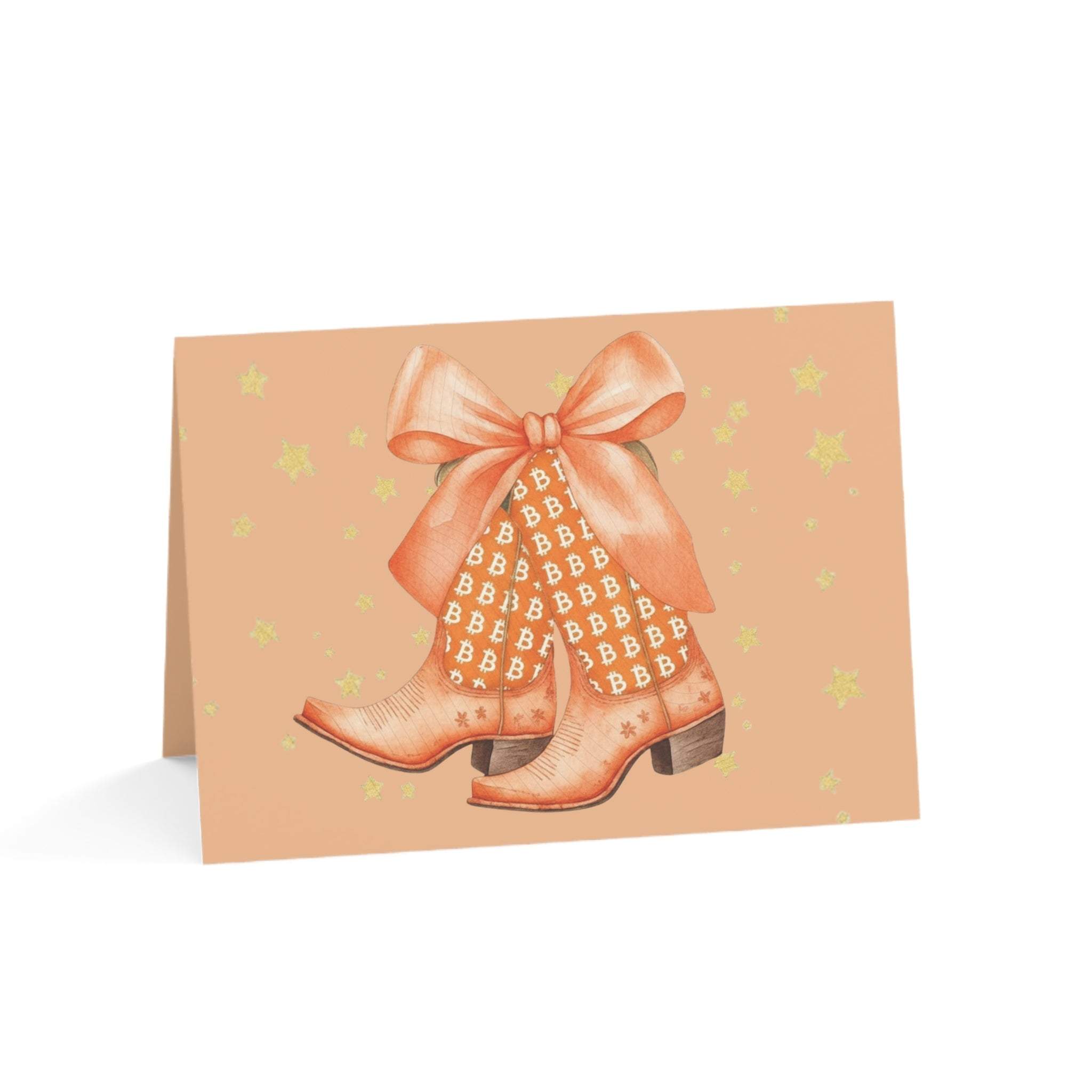 Watercolor Bitcoin Boots greeting card with orange boots, golden Bitcoin patterns, and a bow on peach background with stars